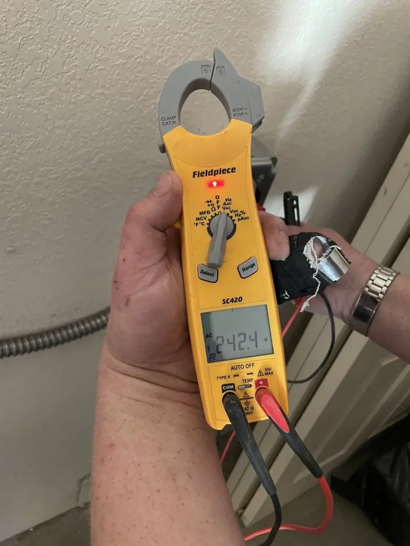 Voltage testing with clamp meter during Ceiling Fan Installation in Avenal